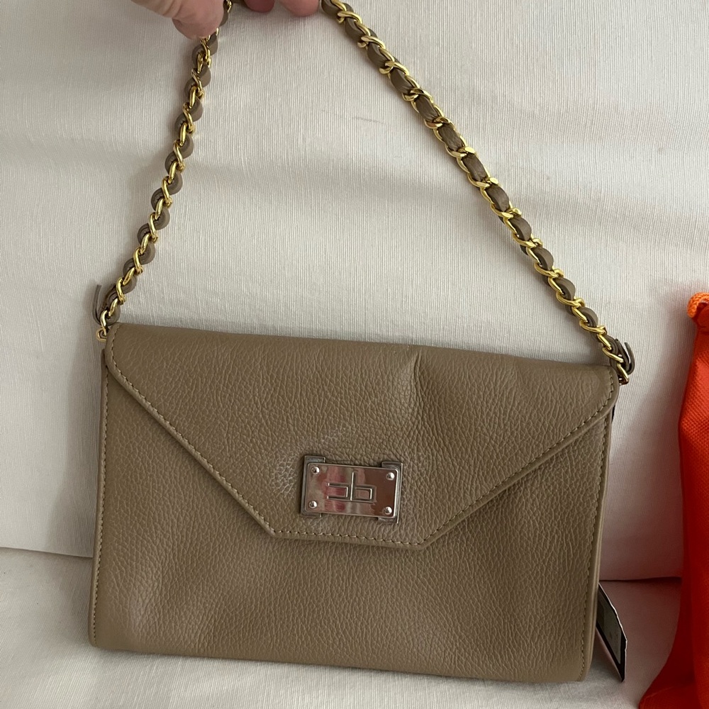 Courage B clutch bag 9 3/4 length 6 1/2 depth. Chain link strap can be removed.